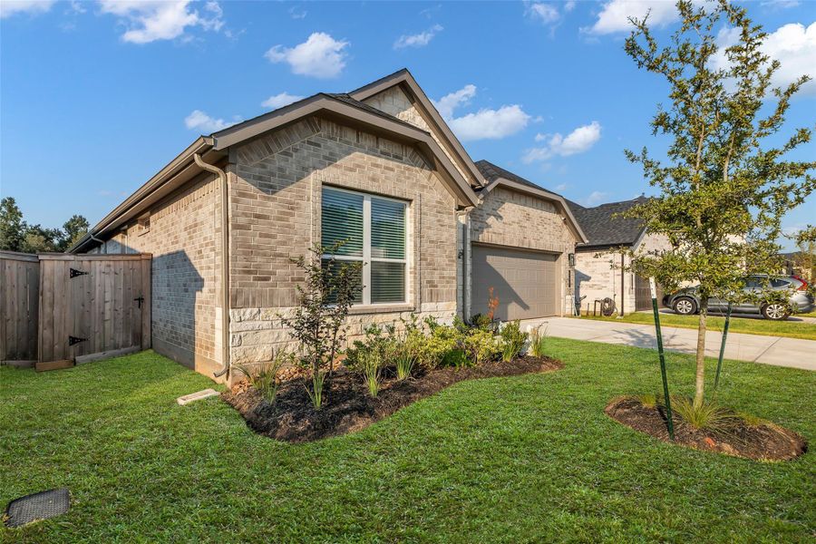 Front exterior of a new home in , Conroe, TX, highlighting curb appeal (Image 20).