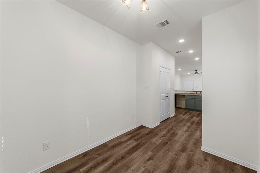 Corridor with dark wood-type flooring