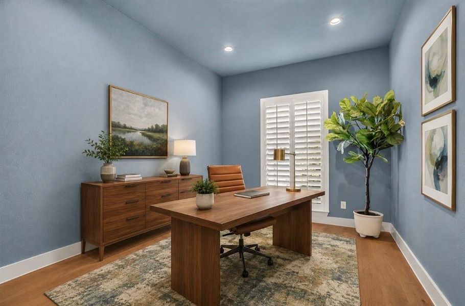 Dedicated room with wood-finish flooring, recessed lighting, and a white plantation shutter window Dedicated room with wood-finish flooring, recessed lighting, and a white plantation shutter window