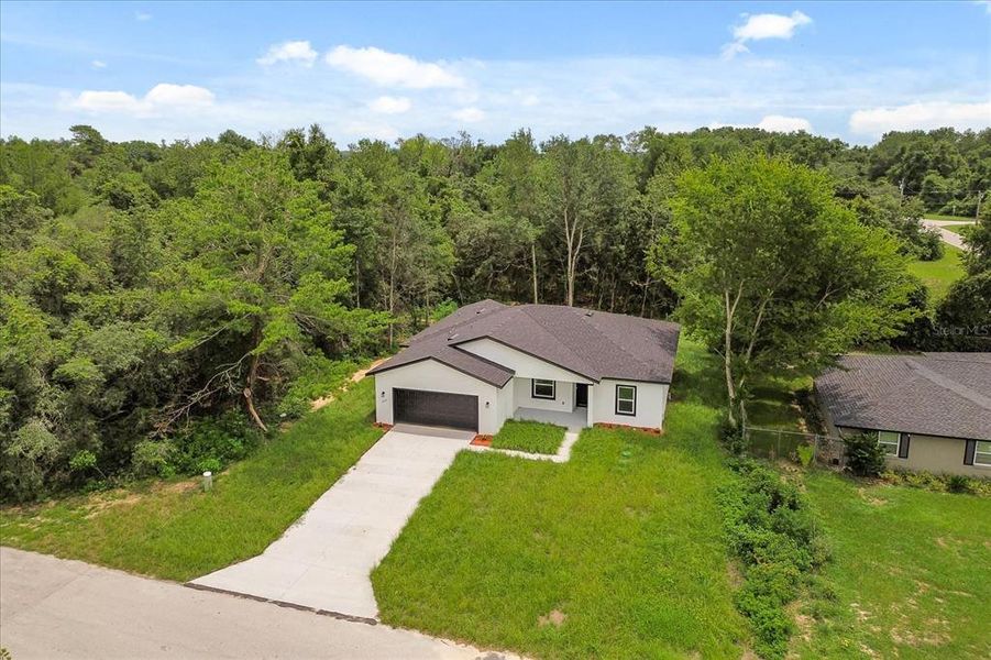 Front exterior of a new home in , Ocala, FL, highlighting curb appeal (Image 18). Front exterior of a new home in , Ocala, FL, highlighting curb appeal (Image 18).