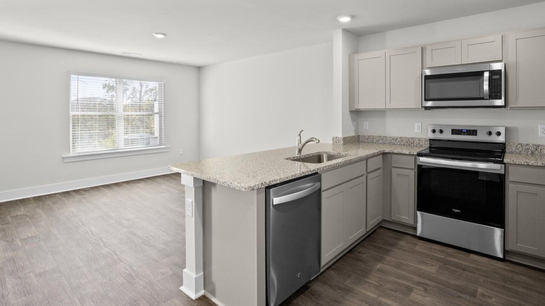 Furnished interior view inside a new home in Waterside Townhomes, Surf City (Image 7). Furnished interior view inside a new home in Waterside Townhomes, Surf City (Image 7).