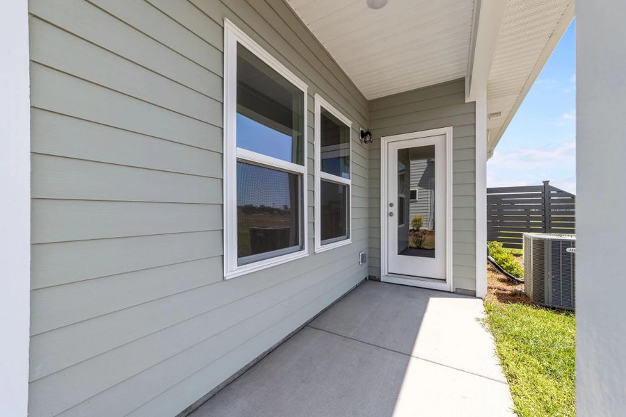 Exterior details and patio area of a home in Blue Heron Retreat, Little River (Image 3).