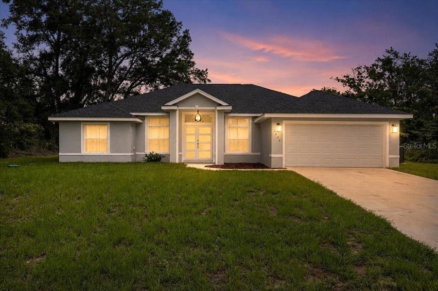 Front exterior of a new home in , Summerfield, FL, highlighting curb appeal (Image 20).