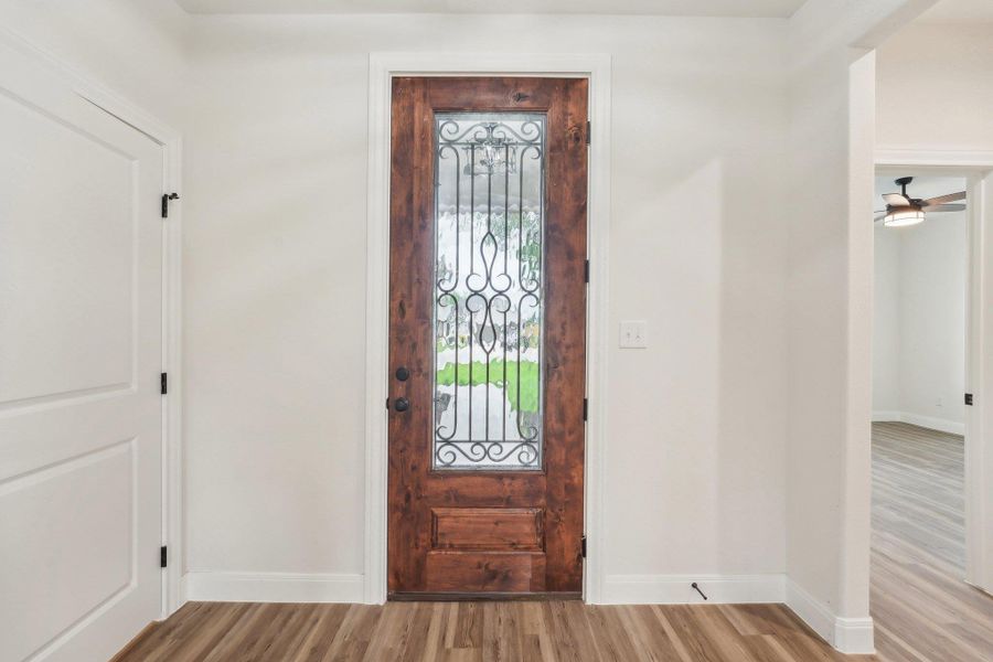 Entryway with baseboards, Vinyl Wood Plank floors, and ceiling fan Entryway with baseboards, Vinyl Wood Plank floors, and ceiling fan