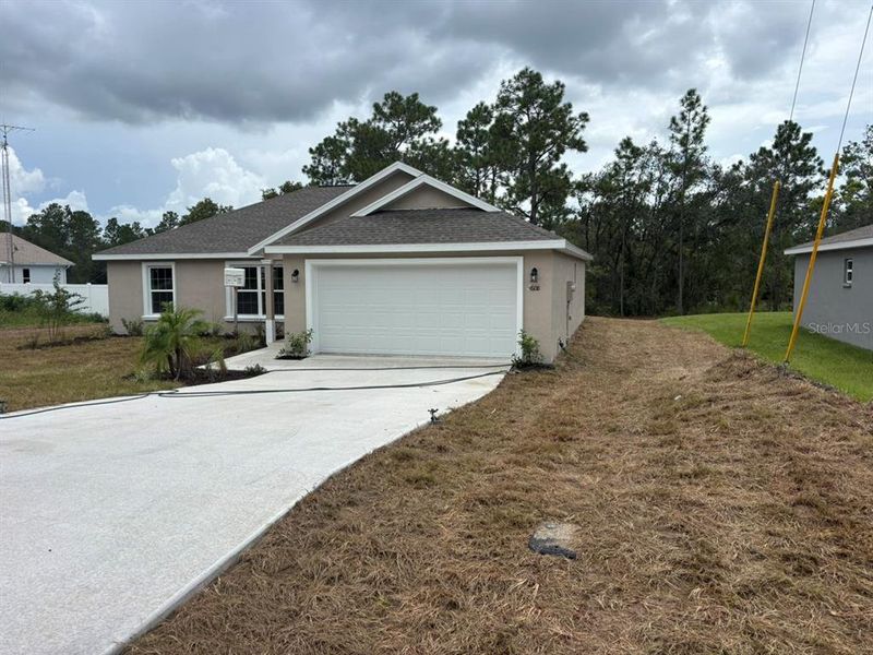 Front exterior of a new home in , Dunnellon, FL, highlighting curb appeal (Image 2). Front exterior of a new home in , Dunnellon, FL, highlighting curb appeal (Image 2).