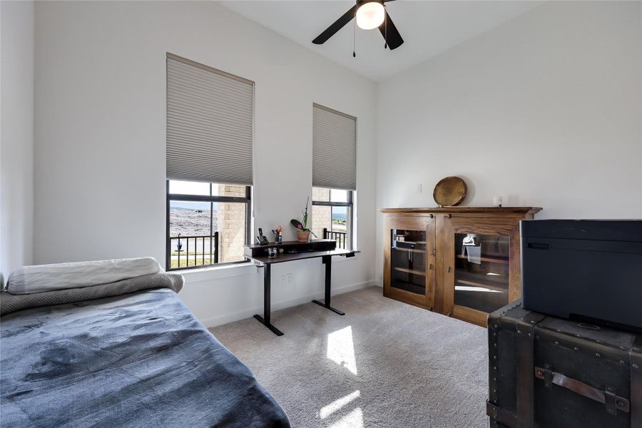 High ceilings and soft carpeting define this versatile space illuminated by twin windows. High ceilings and soft carpeting define this versatile space illuminated by twin windows.