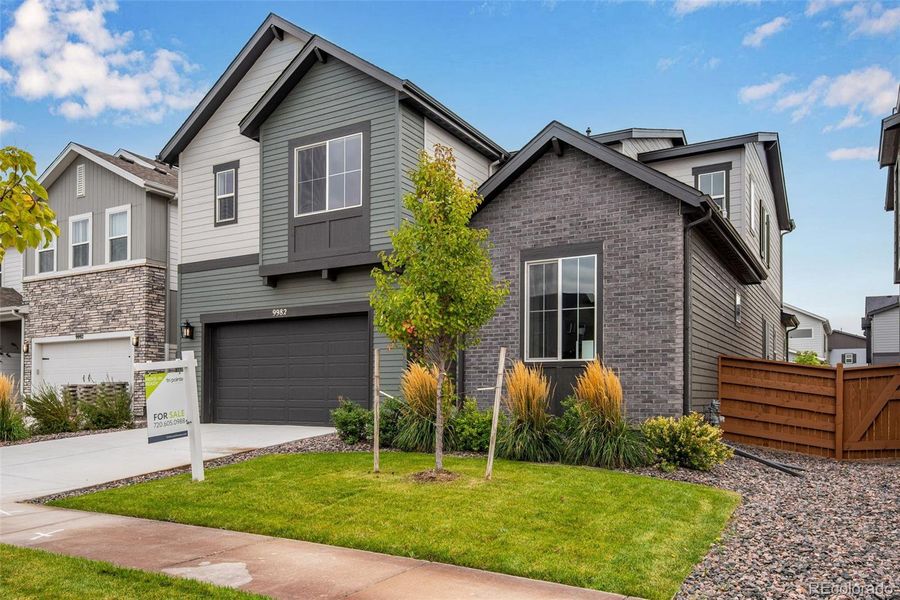 Front exterior of a new home in Reunion Ridge, Commerce City, CO, highlighting curb appeal (Image 2).