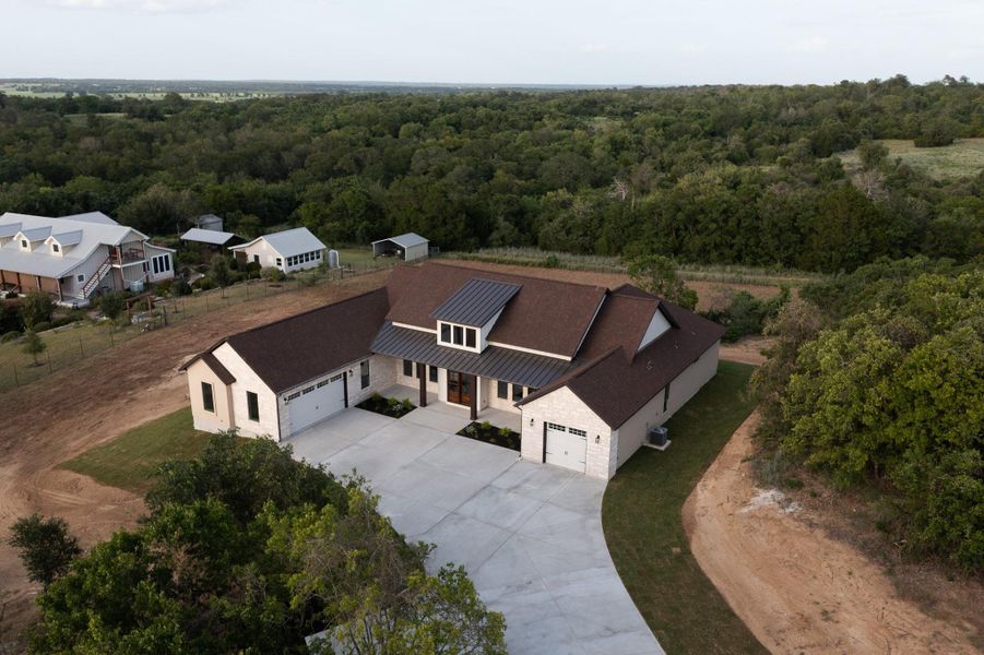 View of subject property with a forest View of subject property with a forest