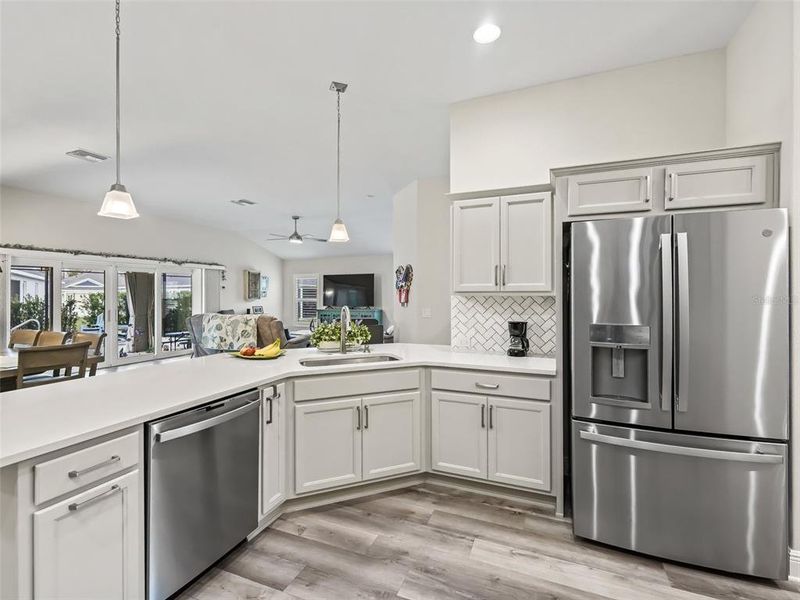 Kitchen with quartz counter tops and Marble backsplash in herringbone pattern