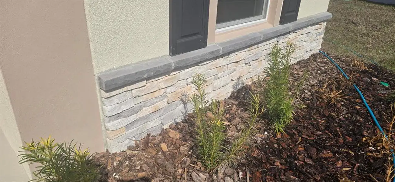 Exterior details and patio area of a home in Poinciana, Poinciana (Image 3).