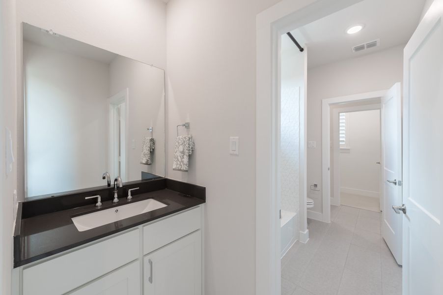 Representative furnished interior of a home built from the Bogata by Tri Pointe Homes in Harvest Green, Richmond (Image 42).