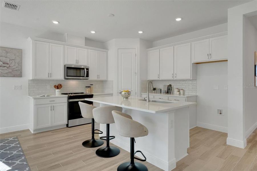 Furnished interior view inside a new home in Green Key Village, Lady Lake (Image 9).