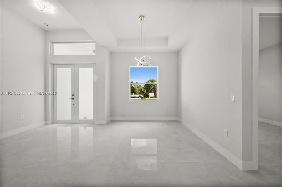 Foyer with french doors and a tray ceiling Foyer with french doors and a tray ceiling