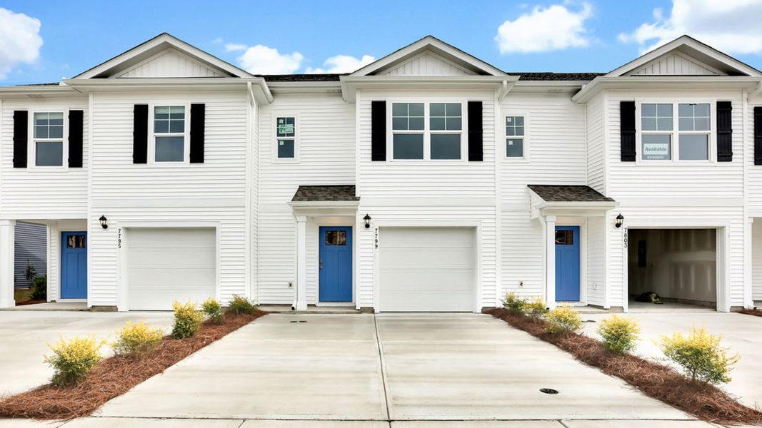 Front exterior of a new home in Grayson Park Townhomes, Leland, NC, highlighting curb appeal (Image 1).