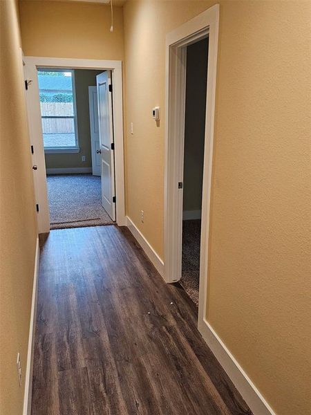 Hallway featuring hardwood / wood-style floors