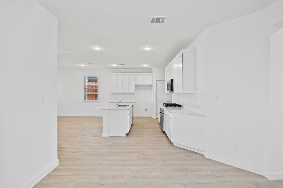 Kitchen in the Oak home plan by Trophy Signature Homes – REPRESENTATIVE PHOTO Kitchen in the Oak home plan by Trophy Signature Homes – REPRESENTATIVE PHOTO