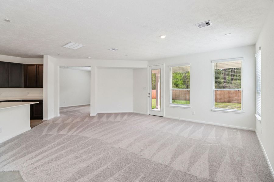 The expansive inset is perfectly proportioned for a large-scale flat-screen television or a statement piece of oversized artwork, keeping the family room uncluttered.
