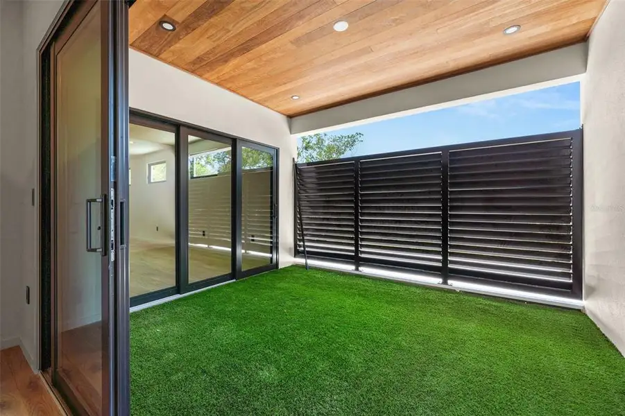 Exterior details and patio area of a home in , Sarasota (Image 35).