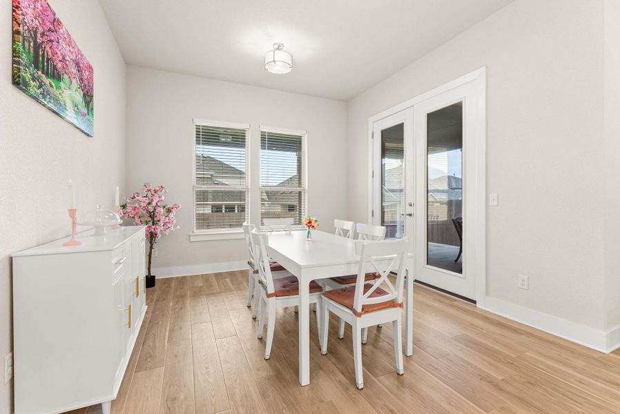 The breakfast area has French doors to the back yard.