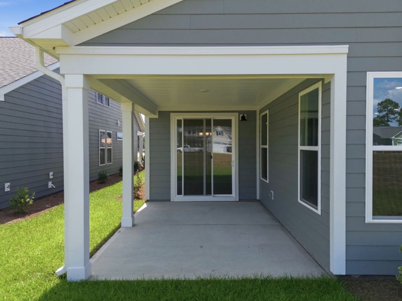 Exterior details and patio area of a home in Terrapin, Leland (Image 3).