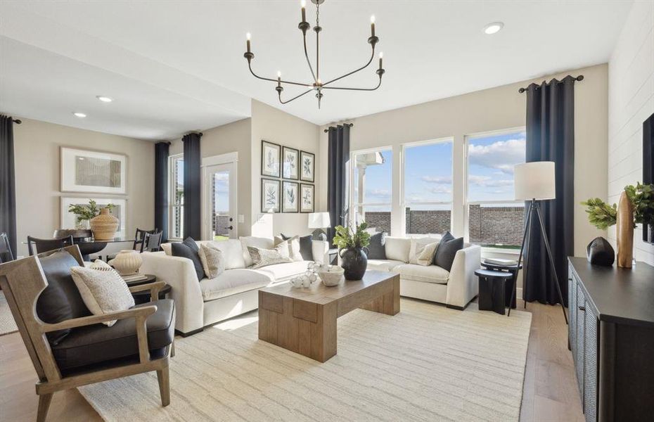 *Model Representation - Spacious gathering room with large windows