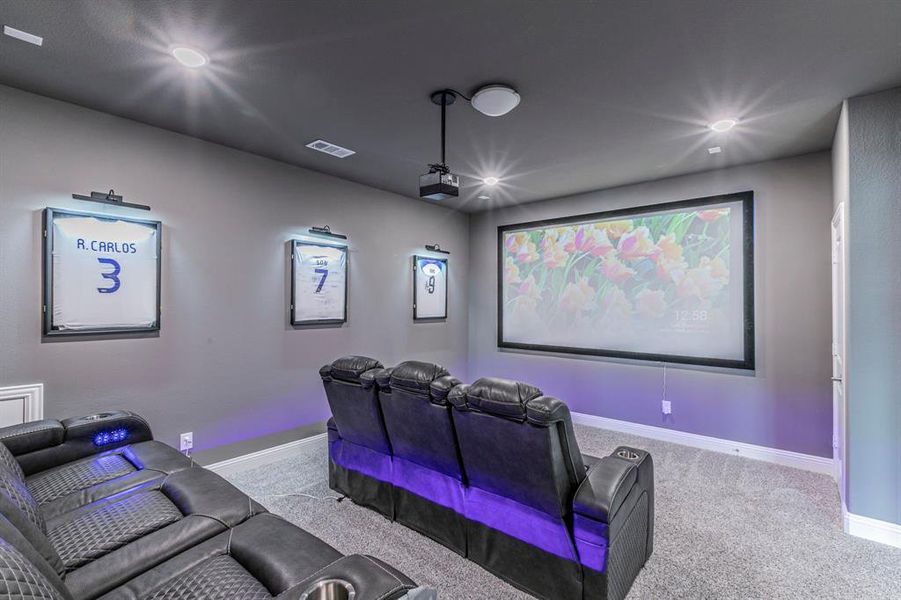 Cinema room with light carpet and recessed lighting Cinema room with light carpet and recessed lighting