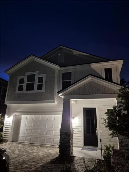 Front exterior of a new home in Brook Forest, St. Augustine, FL, highlighting curb appeal (Image 9). Front exterior of a new home in Brook Forest, St. Augustine, FL, highlighting curb appeal (Image 9).