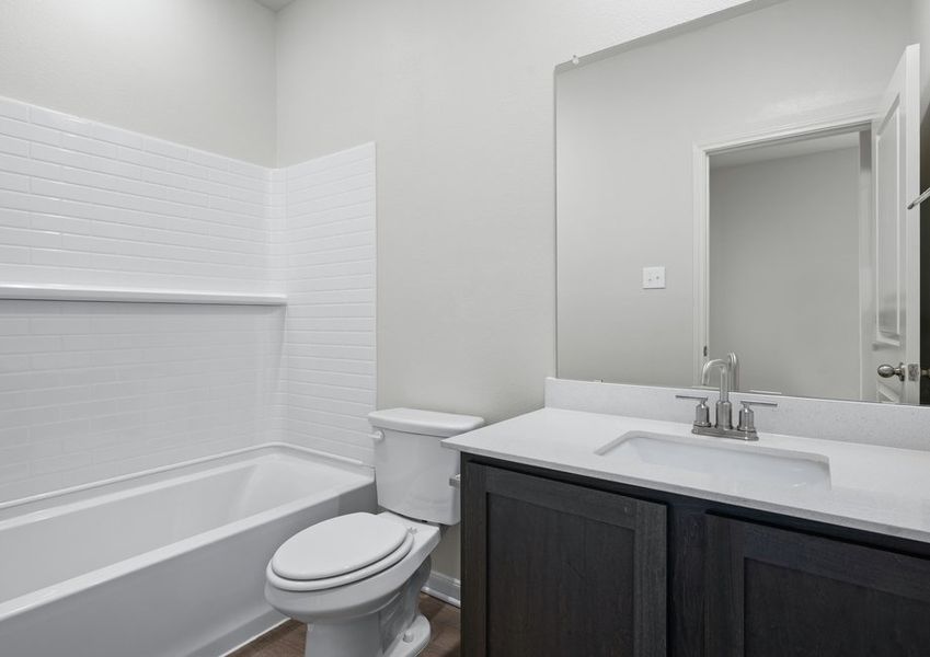 The secondary bathroom has a spacious vanity and shower-tub combo. The secondary bathroom has a spacious vanity and shower-tub combo.