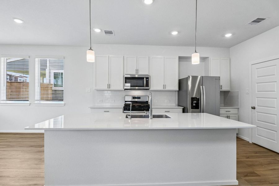 Photos are not of the actual home, but are photos of the builder home with same floorplan with similar interior finishes.