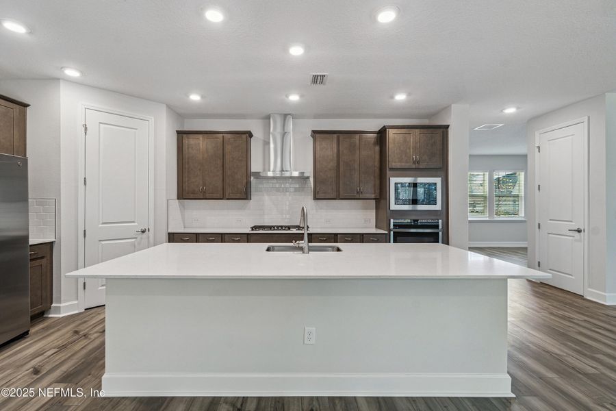 Furnished interior view inside a new home in Tributary 70', Yulee (Image 8).
