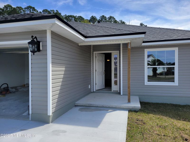 Front exterior of a new home in , Callahan, FL, highlighting curb appeal (Image 15).