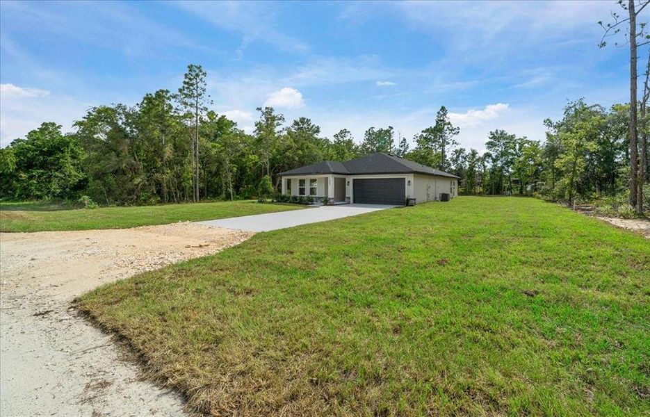Front exterior of a new home in , Brooksville, FL, highlighting curb appeal (Image 25). Front exterior of a new home in , Brooksville, FL, highlighting curb appeal (Image 25).