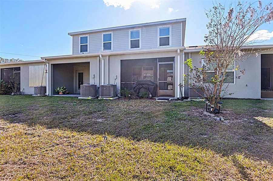 Exterior details and patio area of a home in Anclote Square, Holiday (Image 23).