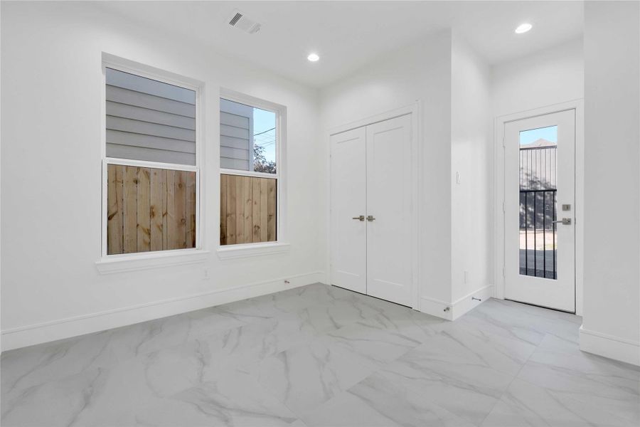 Spacious first-floor en-suite bedroom featuring a separate entrance—ideal for guests, a dedicated office, or potential short-term rental use.