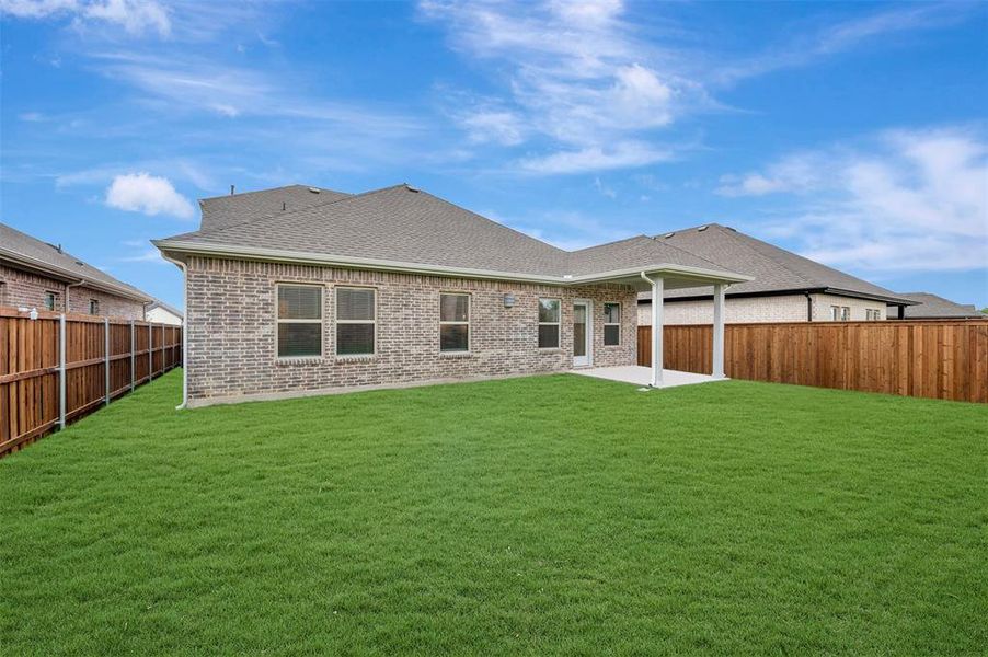 Exterior details and patio area of a home in Aspire at Reunion, Newark (Image 3).