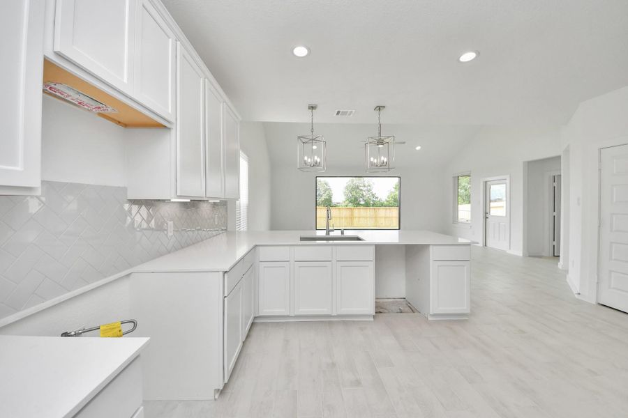 The extended counter area adds both practicality and style, making meal preparation a breeze. Every detail is thoughtfully designed to enhance the kitchen's functionality and aesthetic appeal.