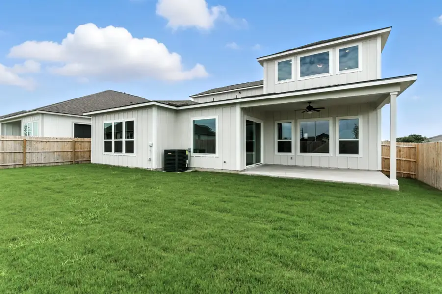 Front exterior of a new home in Weltner Farms 60’s, New Braunfels, TX, highlighting curb appeal (Image 2).