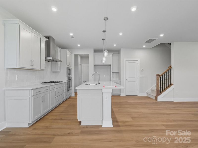 Open rail and 9' ceilings encourage a flow of light and air.