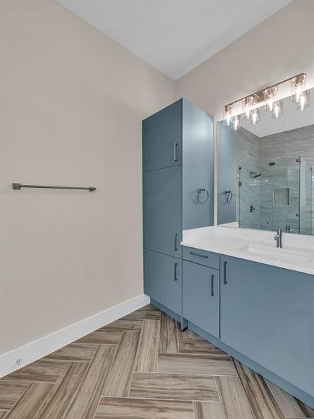 Bathroom with a shower with door and vanity