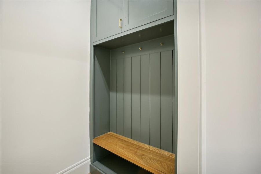 the mudroom has a built in for storage and backpacks.