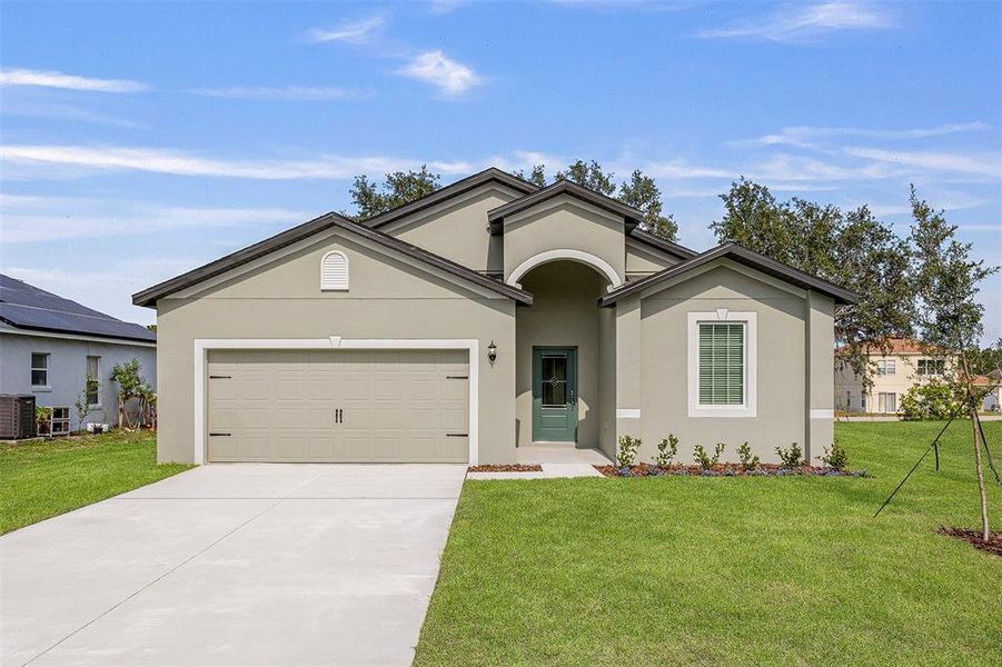 Front exterior of a new home in Poinciana, Poinciana, FL, highlighting curb appeal (Image 2). Front exterior of a new home in Poinciana, Poinciana, FL, highlighting curb appeal (Image 2).