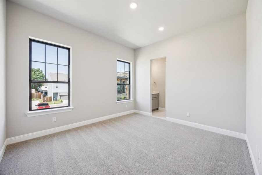 Large bedroom with two windows for plenty of natural light.