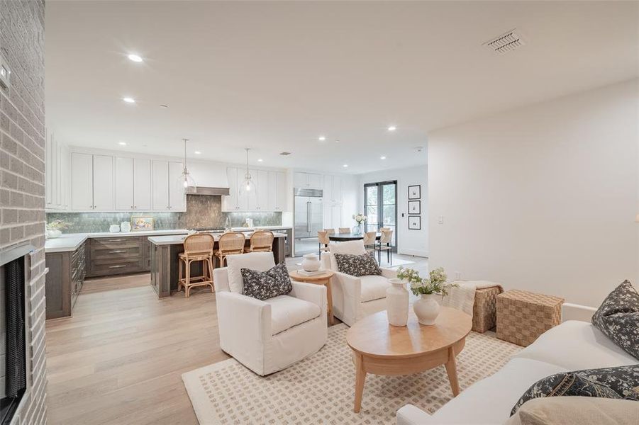 Living room with light hardwood / wood-style flooring