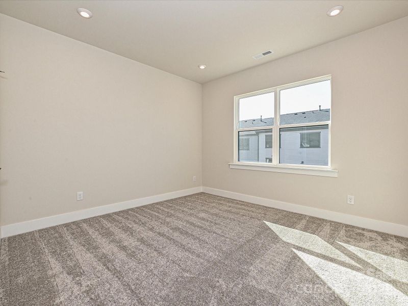 Secondary bedroom seeped in natural light.