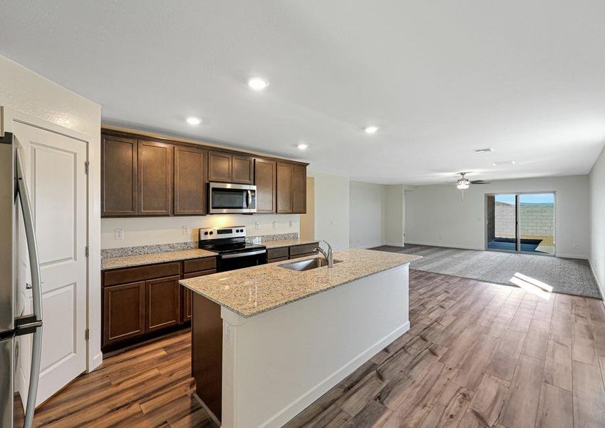 The kitchen overlooks the spacious living area.