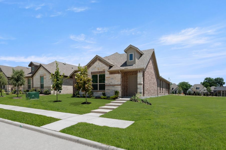 Front exterior of a new home in Redden Farms – Active Adult, Midlothian, TX, highlighting curb appeal (Image 2). Front exterior of a new home in Redden Farms – Active Adult, Midlothian, TX, highlighting curb appeal (Image 2).