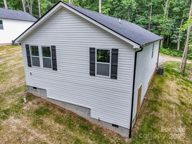 Front exterior of a new home in , Candler, NC, highlighting curb appeal (Image 28).