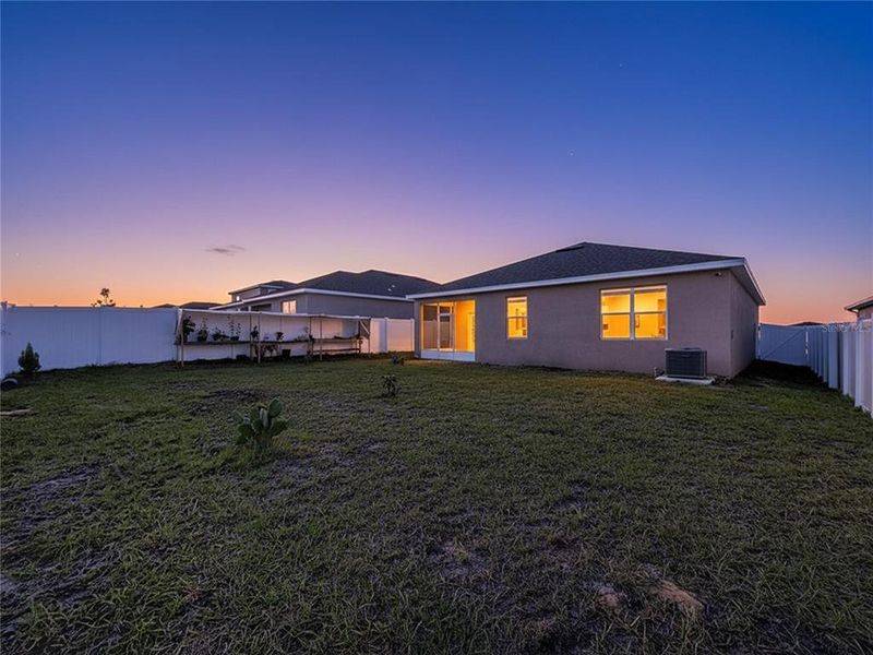 Exterior details and patio area of a home in Covered Bridge at Liberty Bluff, Haines City (Image 3).
