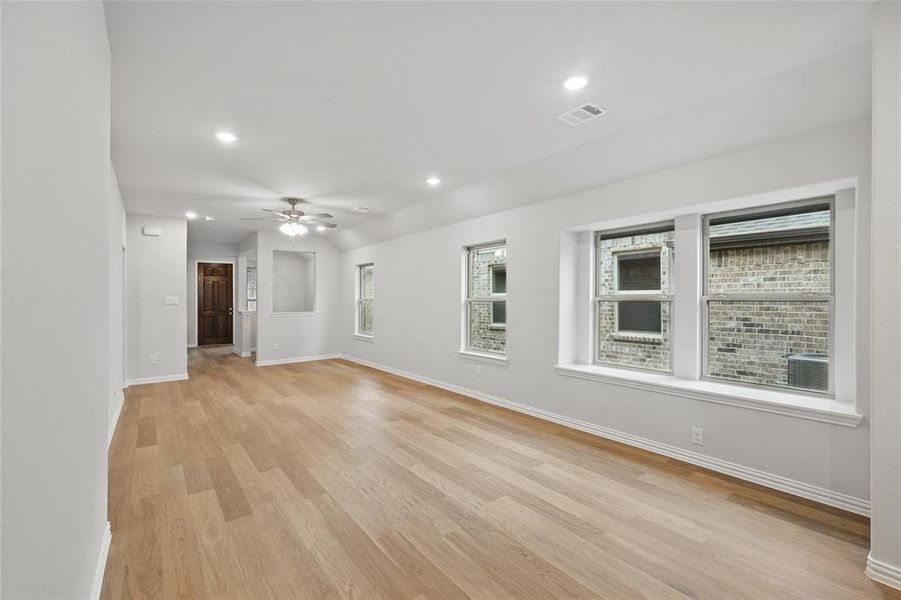 Spare room featuring recessed lighting, light wood-type flooring, and a ceiling fan
