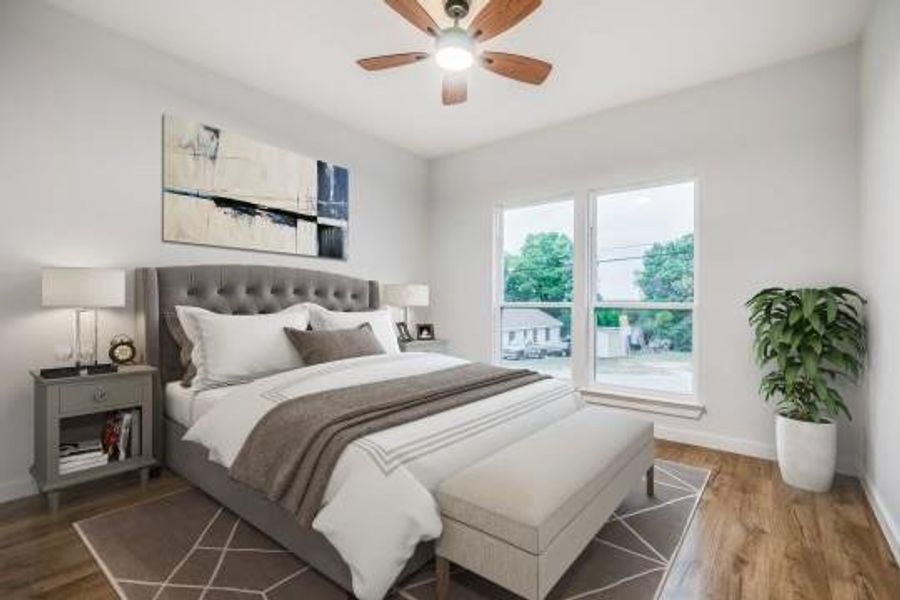 Bedroom featuring hardwood / wood-style flooring and ceiling fan